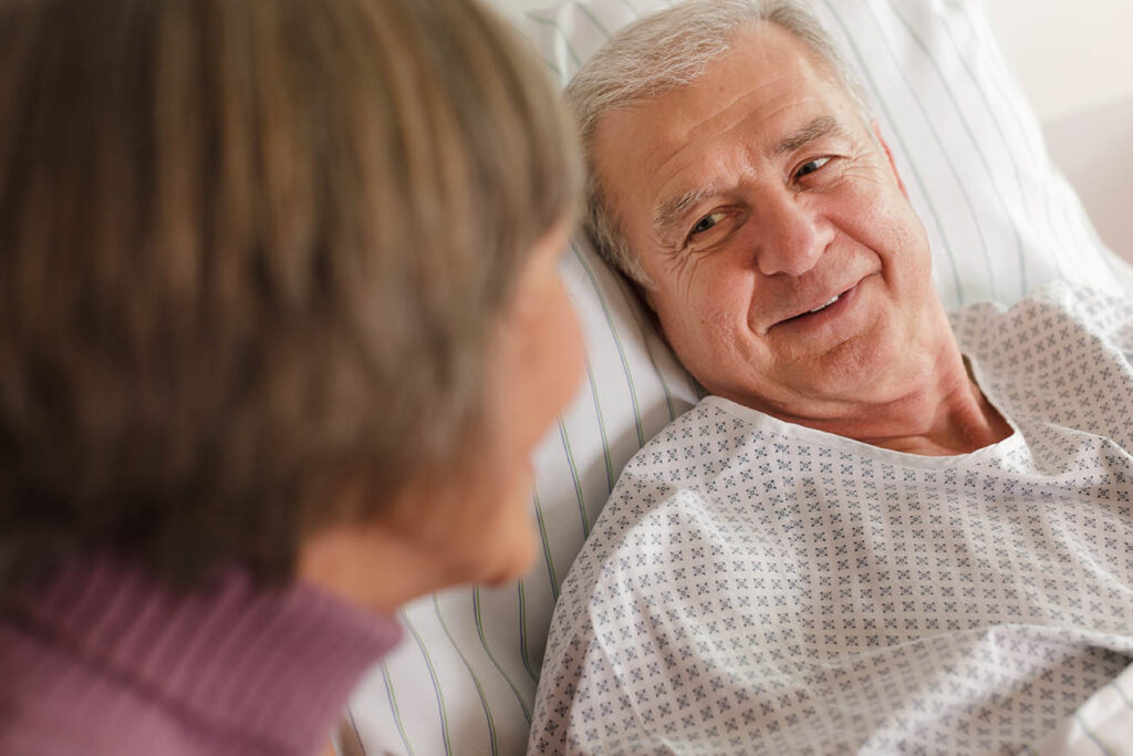 Senior Patient in Hospital Bed