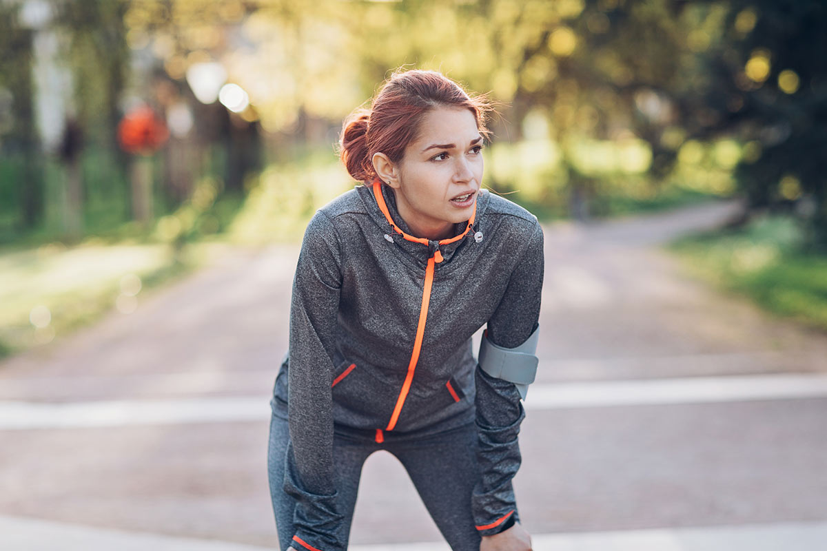 Runner catching her breath during a run